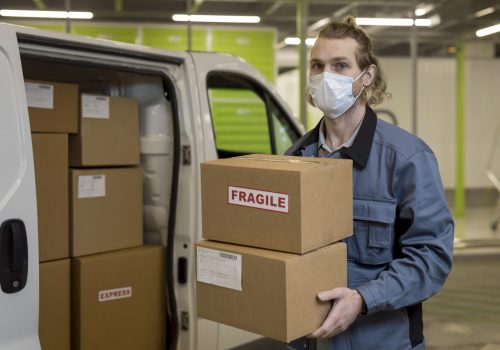 medium-shot-man-carrying-boxes